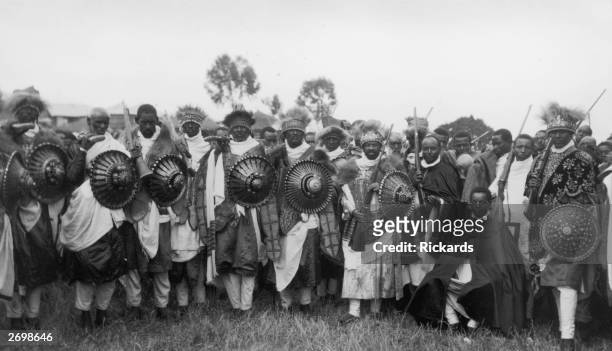 Group of soldiers from the army of Abyssinia , carrying reinforced shields and rifles during the war with Italy.