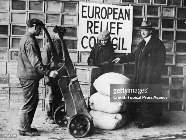 American politician and later the 31st President of the United States, Herbert Hoover, overseeing the shipping of relief supplies to post-war Europe...