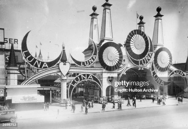 People outside the entrance to Luna Park on Coney Island, New York.