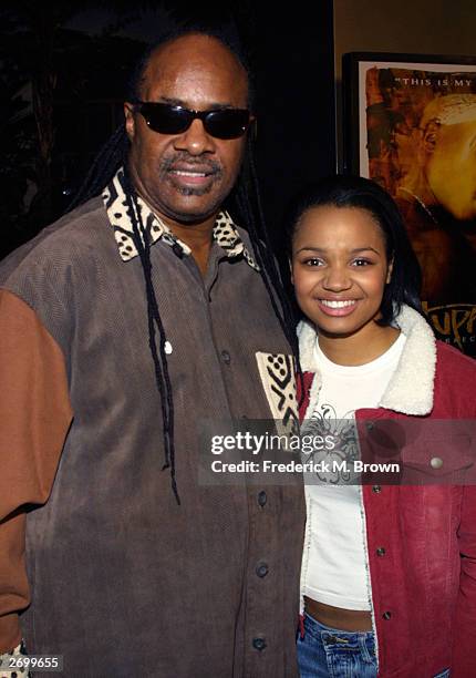 Recording artist Stevie Wonder and actor Kyla Pratt attend the film premiere of "Tupac Resurrection" at the Cinerama Dome Theater on November 4, 2003...