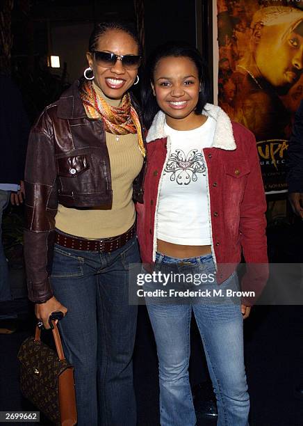 Recording artist MC Lyte and actor Kyla Pratt attend the film premiere of "Tupac Resurrection" at the Cinerama Dome Theater on November 4, 2003 in...