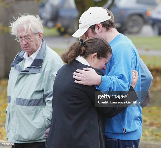 Local well-wishers pay their respects outside Birkbeck School and Community Arts College on November 5, 2003 in North Somercotes, Lincolnshire,...