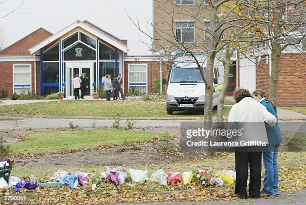 Mother and daughter arrive to pay their respects outside Birkbeck School and Community Arts College on November 5, 2003 in North Somercotes,...