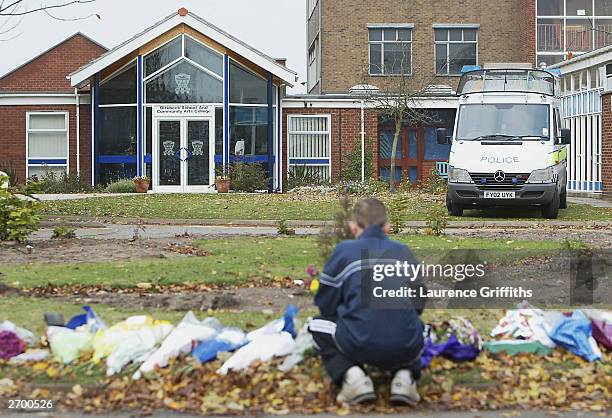 Flowers are left in front of Birkbeck School and Community Arts College where pupil Luke Walmsley was stabbed to death by a fellow classmate in North...