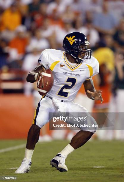 Quarterback Rasheed Marshall of the West Virgina Mountaineers drops back to pass against the University of Miami Hurricanes October 2, 2003 at The...