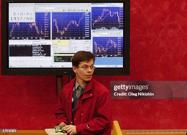 Trader at work in the Moscow Interbank Currency Exchange November 5, 2003 in Moscow, Russia. Shares in Yukos and Sibneft shed 3.2 percent and 2.1...