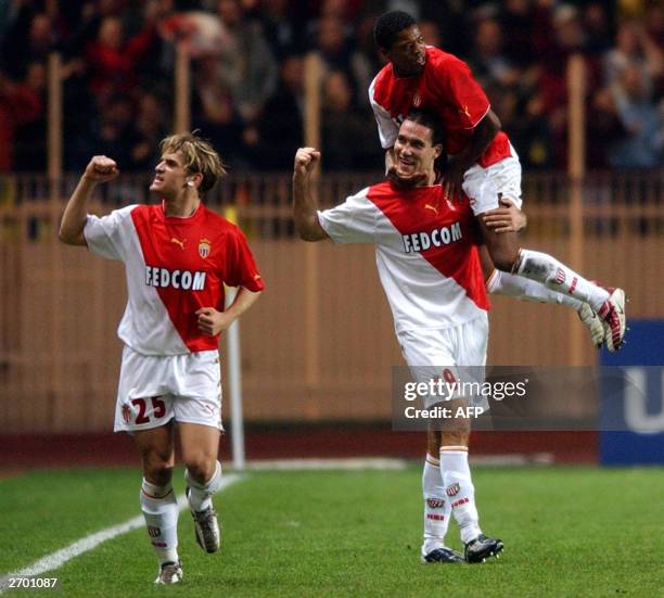 Monaco forwards Jerome Rothen Dado Prso and defender Patrice Evra jubilate after scoring a goal, 05 November 2003, at the Louis II stadium in Monaco...