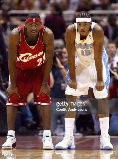 LeBron James of the Cleveland Cavaliers and Carmelo Anthony of the Denver Nuggets take a breather as the wait for play to resume November 5, 2003 at...