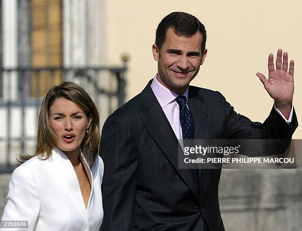 Prince Felipe of Spain and his fiancee, Spanish journalist Letizia Ortiz Rocasolano, wave at the Pardo Palace near Madrid 06 November 2003. Prince...