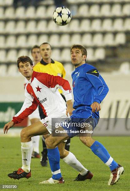 Adam Petrous of Slavia Prague heads the ball past Georgi Chilikov of Levski Sofia during the Slavia Prague v Levski Sofia UEFA Cup 2nd Round match...