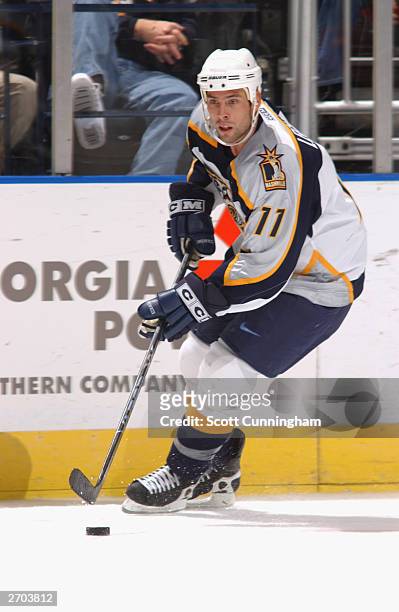 David Legwand of the Nashville Predators controls the puck during the game against the Atlanta Thrashers at Philips Arena on October 3, 2003 in...