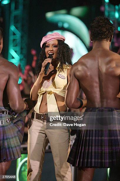 Singer Christina Aguilera performs with men in kilts at the MTV Europe Music Awards 2003 on November 6, 2003 in Edinburgh, Scotland.