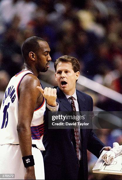 Head coach Danny Ainge and forward Danny Manning of the Phoenix Suns confer during a game against the Orlando Magic at the America West Arena in...