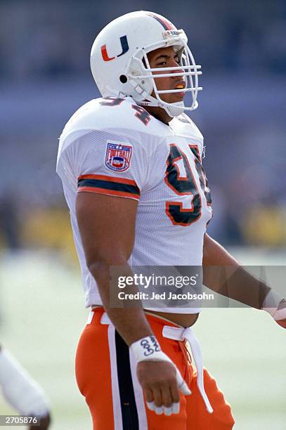 Defensive end Dwayne Johnson of the University of Miami Hurricanes walks on the field during the NCAA game against the University of Virginia on...