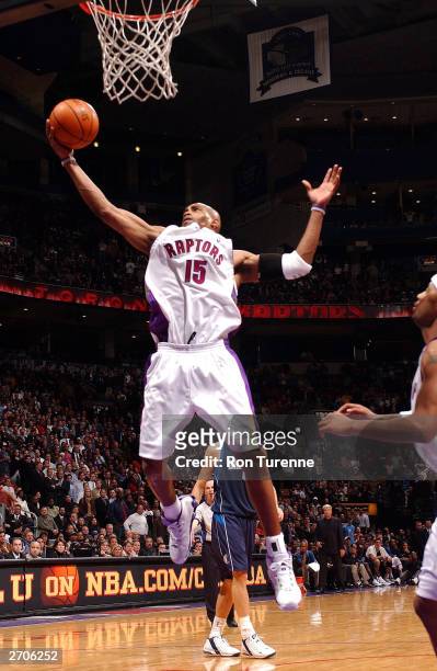 Vince Carter of the Toronto Raptors pulls down the defensive reboubd against the Dallas Mavericks on November 6, 2003 at the Air Canada Centre in...
