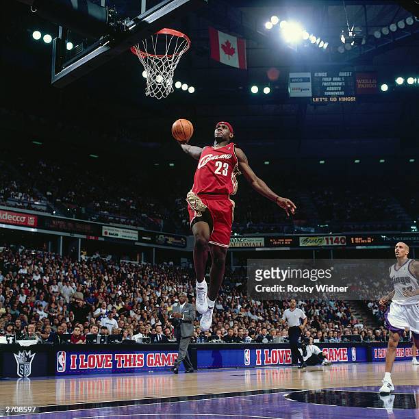 LeBron James of the Cleveland Cavaliers goes for a dunk against the Sacramento Kings during the NBA game at the Arco Arena on October 29, 2003 in...
