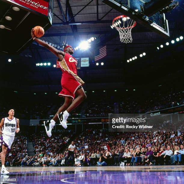LeBron James of the Cleveland Cavaliers goes for a dunk against the Sacramento Kings during the NBA game at the Arco Arena on October 29, 2003 in...