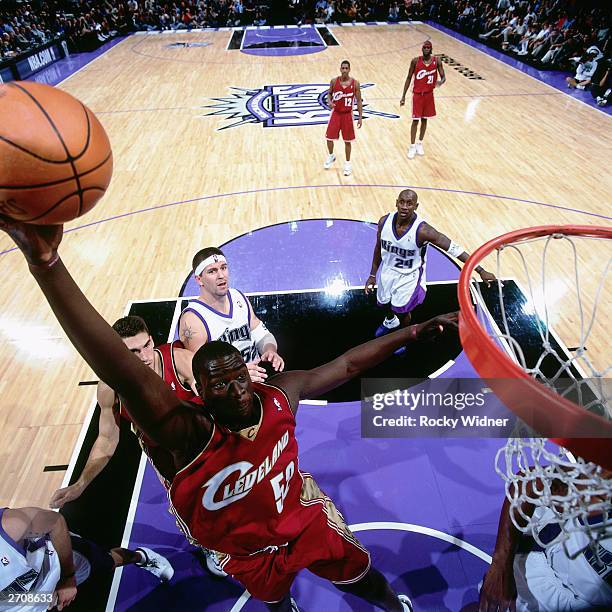 DeSagana Diop of the Cleveland Cavaliers goes for a dunk against the Sacramento Kings during the NBA game at the Arco Arena on October 29, 2003 in...