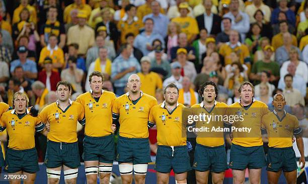 The Australian team sing their national anthem during the Rugby World Cup Quarter Final match between Australia and Scotland at Suncorp Stadium...