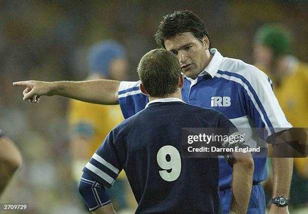 Referee Steve Walsh talks with Scotland captain Bryan Redpath during the Rugby World Cup Quarter Final match between Australia and Scotland at...