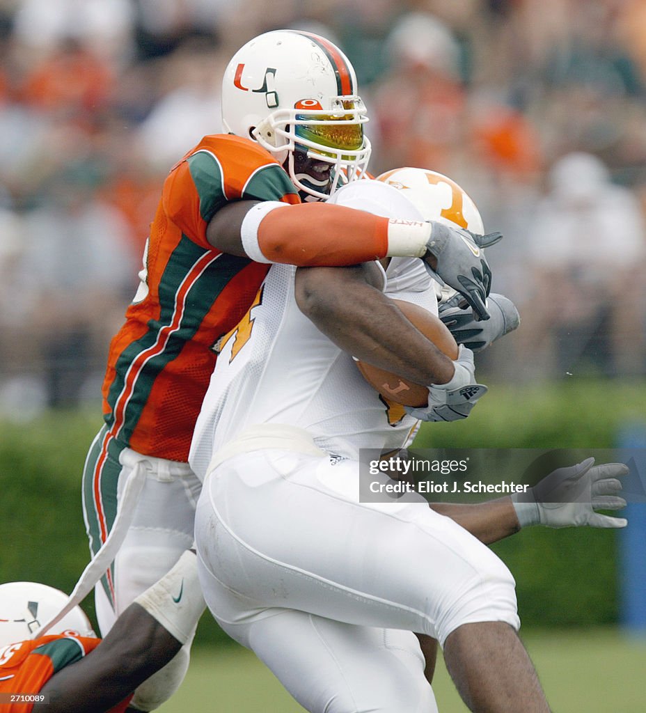 Jabari Davis is tackled by Maurice Sikes