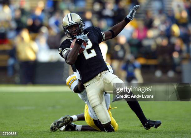Ray Williams of the Purdue Boilermakers runs with the ball against against the Iowa Hawkeyes November 8, 2003 at Ross-Ade Stadium in West Lafayette,...