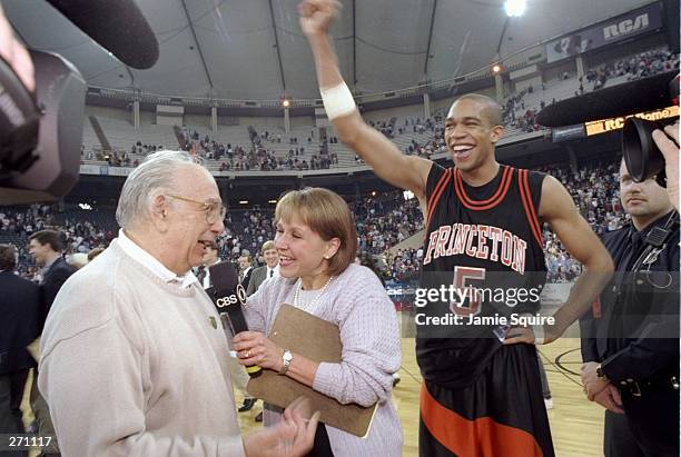 Guard Sydney Johnson and coach Pete Carril of the Princeton Tigers celebrate after a game against the UCLA Bruins at the RCA Dome in Indianapolis,...