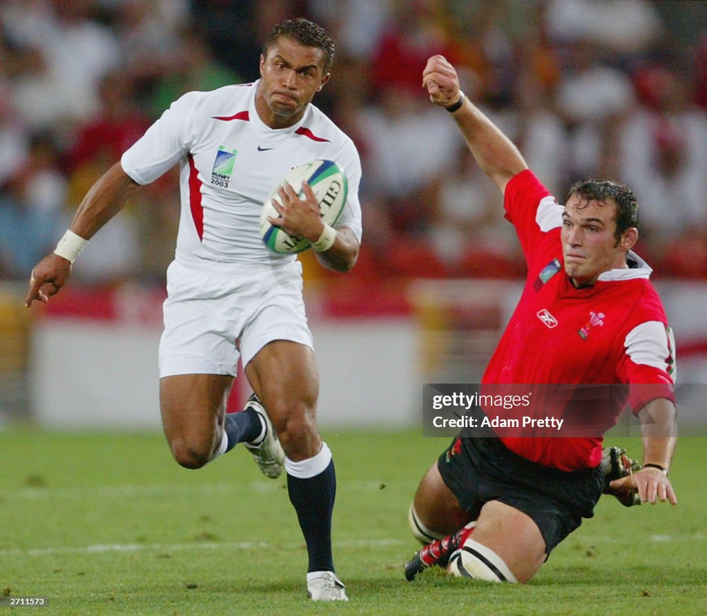 Jason R Rugby Jason Robinson of England steps past a Wales defender during the ...