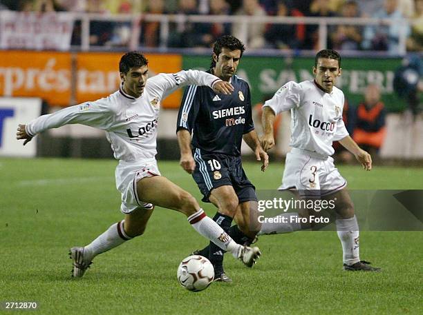 Reyes of Sevilla and Figo of Real Madrid during the Spanish Primera Liga match between Sevilla and Real Madrid at the Sanchez Pizjuan Stadium...