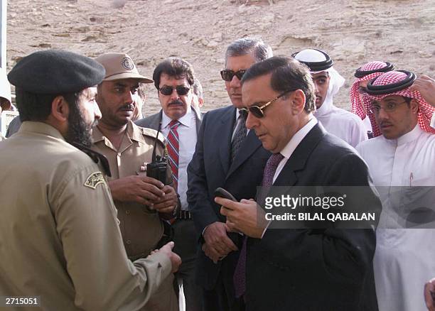 Lebanese ambassador to Saudi Arabia Ahmad Shammat talks to security guards at the entrance of al-Muhaya expatriate housing compound in the Wadi Laban...