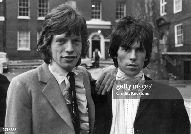 Mick Jagger and Keith Richards of British rock group The Rolling Stones, at Kings Bench Walk, after being released on bail on drug charges.