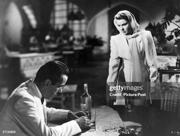 Humphrey Bogart and Ingrid Bergman in a scene from the film 'Casablanca', directed by Michael Curtiz for Warner Brothers. Original Publication:...