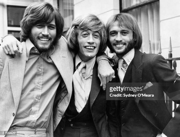 Popular English vocal trio the Bee Gees; from left to right, brothers Barry, Robin and Maurice Gibb .