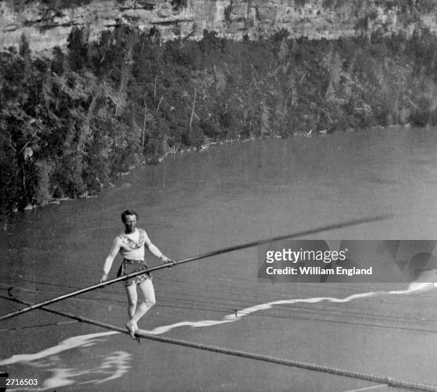 French acrobat and tightrope-walker Charles Blondin , real name Jean Francois Gravelet, crossing Niagara on a tightrope.