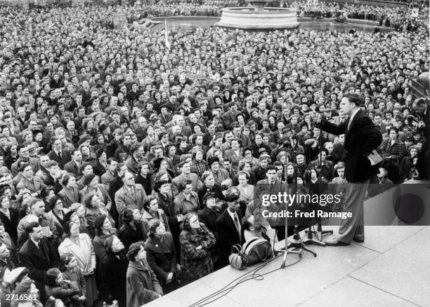 Evangelist Billy Graham addressing the congregation in Trafalgar Square in London.