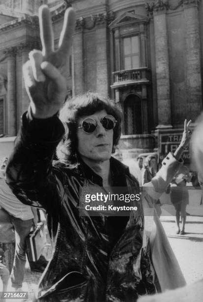 John Paul Getty Jnr , son of oil millionaire John Paul Getty gives a peace sign during a demonstration in Rome in support of the Washington peace...
