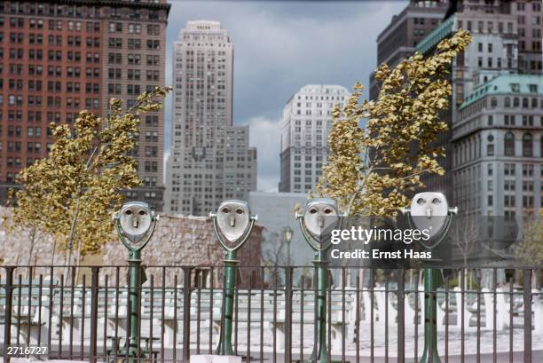 Street binoculars in Battery Park, New York give the appearance of blank-eyed faces. Original Publication: Colour photography book