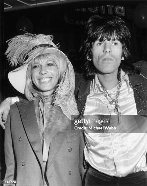 Keith Richards of the Rolling Stones arrives at the premiere of the Beatles film, 'Yellow Submarine' with his girlfriend Anita Pallenberg.