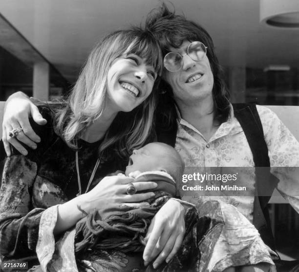 Keith Richards of the Rolling Stones outside King's College Hospital in Dulwich, London, with his wife Anita Pallenberg and their baby son Marlon.