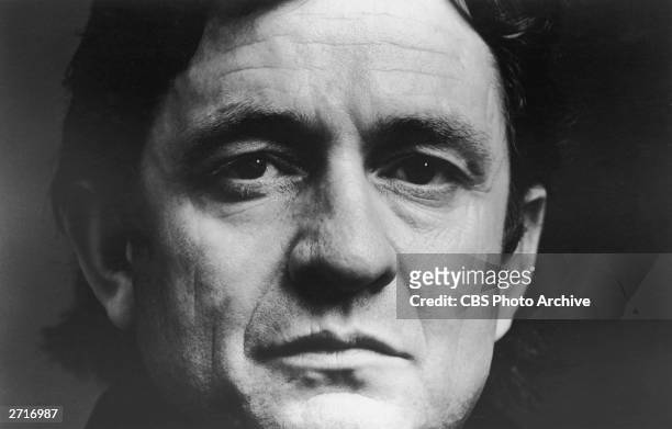 Close-up portrait of American country singer and songwriter Johnny Cash .