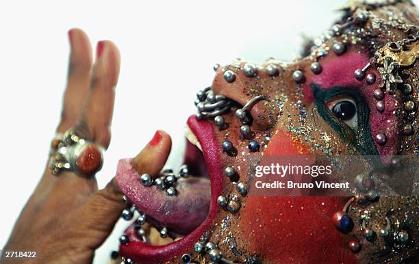 Worlds most pierced woman Elaine Davidson poses for photographers at the photocall for the 100 millionth copy of the Guinness World Records in the...