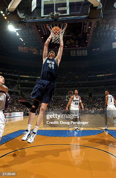 Shawn Bradley of the Dallas Mavericks dunks against the Washington Wizards during the game at the MCI Center on November 5, 2003 in Washington, DC....