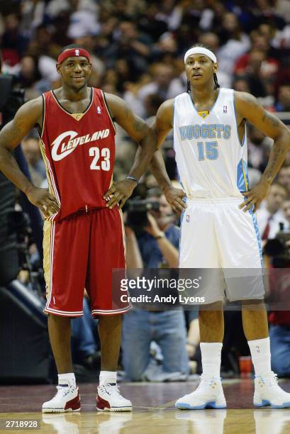 LeBron James of the Cleveland Cavaliers and Carmelo Anthony of the Denver Nuggets look on during the game on November 5, 2003 at Gund Arena in...