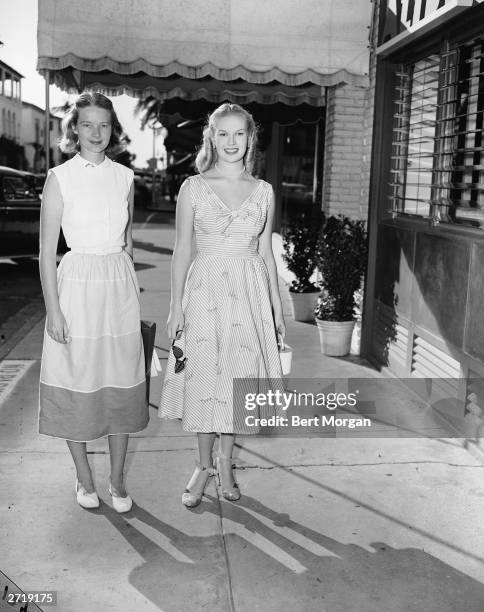 American socialite Mrs. Winston F.C. Guest poses with Mrs. Robert Sweeny, Palm Beach, Florida, 1952.