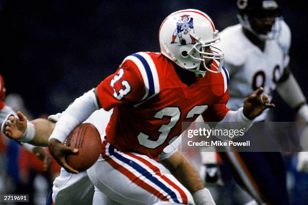 Running back Tony Collins of the New England Patriots carries the ball during Superbowl XX against the Chicago Bears at the Louisiana Superdome on...