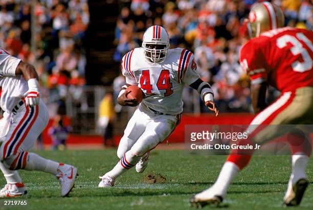 Running back John Stephens of the New England Patriots looks for an opening as he carries downfield during a NFL game against the San Francisco 49ers...