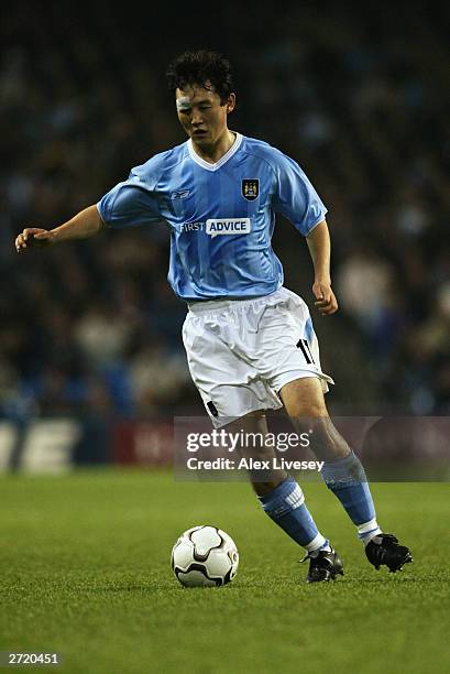 Sun Jihai of Manchester City runs with the ball during the UEFA Cup second round first leg match between Manchester City and Groclin Dyskobolia held...