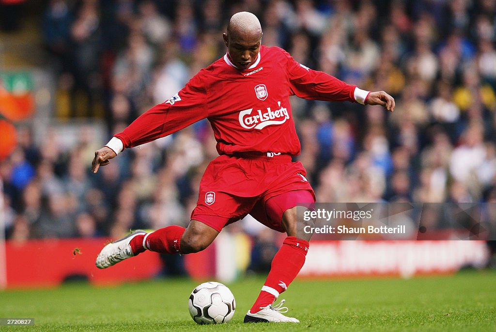 El Hadji Diouf of Liverpool strikes the ball