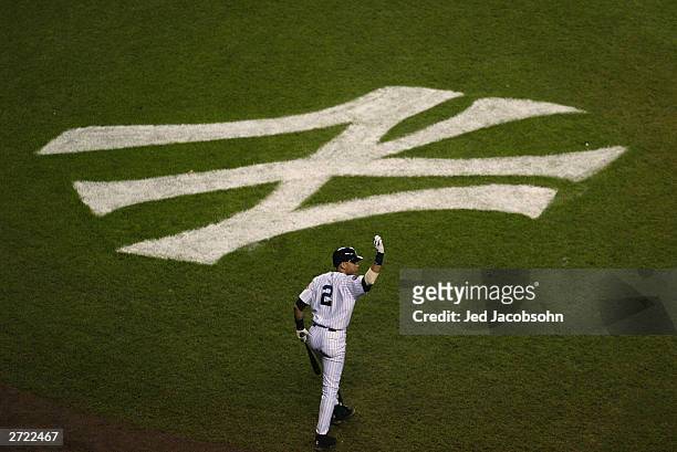 Derek Jeter of the New York Yankees walks to the plate against the Florida Marlins in the seventh inning of game two of the Major League Baseball...