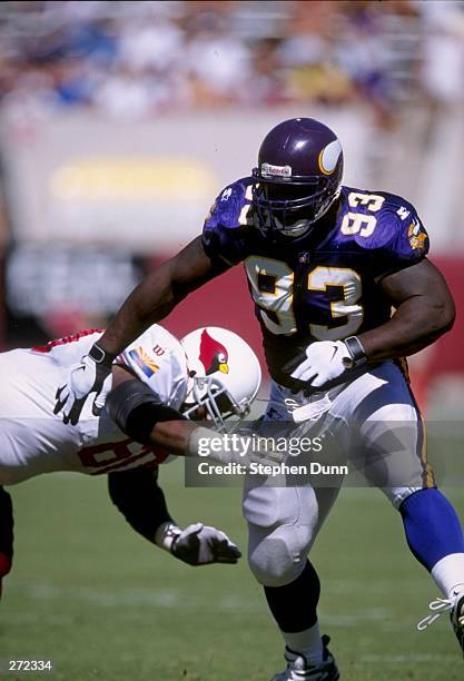 Defensive lineman John Randle of the Minnesota Vikings gets blocked during a game against the Arizona Cardinals at Sun Devil Stadium in Tempe,...